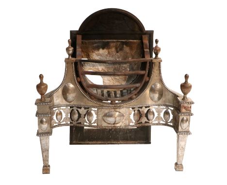 A George III Steel and Iron Fire Grate, circa 1800, of serpentine-shaped form, the pierced and engraved front rail flanked by