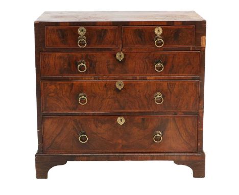 A George II Walnut, Featherbanded and Crossbanded Straight-Front Chest, mid 18th century, of two short over three long gradua