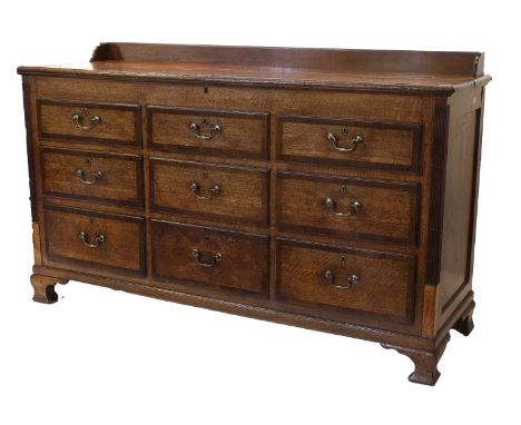 A George III Oak and Mahogany-Crossbanded Lancashire Chest, late 18th century, the three-quarter gallery above a hinged lid e
