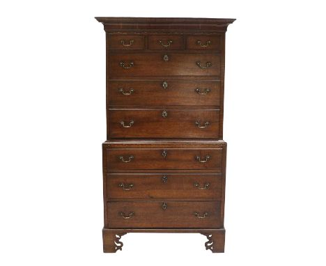 A George III Oak Chest on Chest, late 18th century, the moulded cornice above a walnut-crossbanded frieze with brass stringin