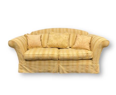 A modern two seater sofa upholstered in a cream and beige striped fabric 82 x 190 x 93cmHow old is the sofa roughly? 20-30yea