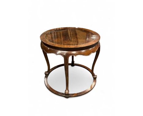 A Chinese hard wood lamp table, circular top above a shaped frieze60 x 63cmThere are various scratches to the rim edge as wel