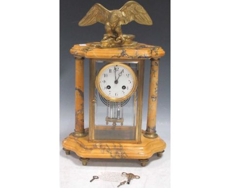 A late 19th century ormolu and Sienna marble mantle clock with mercurial pendulum and striking on a single gong, with gilt me