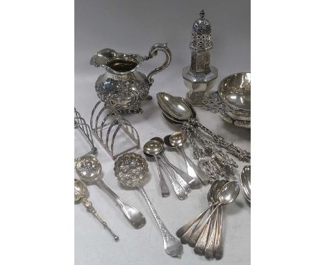 A collection of silverware including flatware; toast racks; mustard; caster; bowl and cream jug, 1360g (43.5ozt) gross; toget
