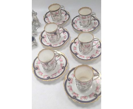 A silver cruet set, together with a set of six Aysnley cups and saucers, the cups with silver holders, 384g (12ozt) weighable