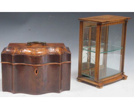 A George III mahogany tea caddy with serpentine front, a hinged lid and shell inlay, 15 x 24 x 14cm; together with a mahogany