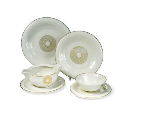 Jean Luce (1895-1964), a porcelain dinner service, decorated with gilt spiral design on an ivory ground, comprising twenty-si