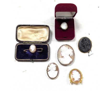 A collection of cameo jewellery, including three brooches tested as 9ct gold and a ring tested as 9ct gold, gross weight 31.4