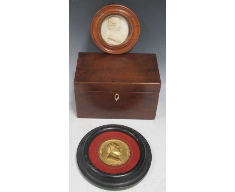 A rectangular mahogany tea caddy, Regency, set with bone escutcheon; together with a framed gilt metal medal of Fridericus Wu