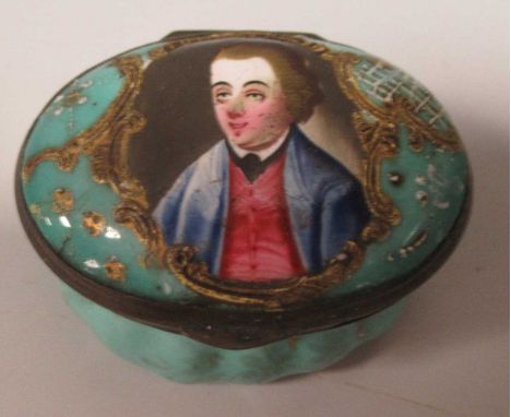 A late 18th century South Staffordshire oval enamel patch box, the lid painted with a gentleman's portrait in a scrollwork ca