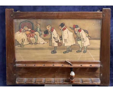 An Arts and Crafts pipe rack, circa 1900, frame by Liberty &amp; Co., inset with a John Hassall lithograph of 'Old King Cole 