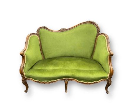 A Victorian loving sofa in the Rococo style, upholstered in green, 96 x 126 x 72cm; an Edwardian nursing chair; and a Victori