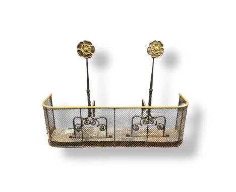 A 19th century brass nursery fender and a pair of wrought iron fire dogs with brass rosette terminals (3)