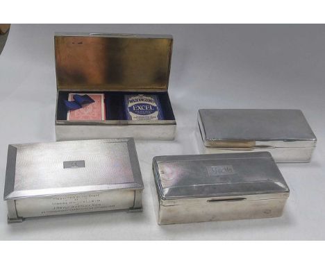 Three silver table cigarette boxes together with a silver table playing card box for Bridge (4)