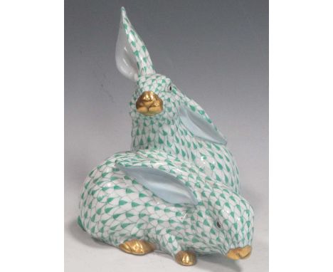 A Herend group of two rabbits in green scale paint decoration and gilt details, 13cm highin good condition, minor surface dir