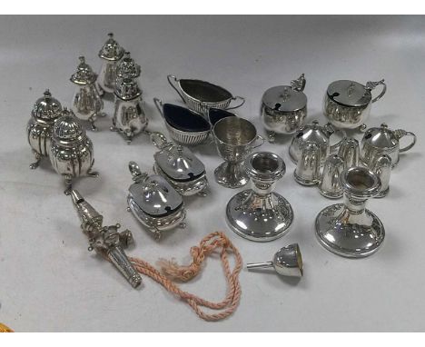 A collection of silver items including cruets, flatware, punch ladle, dressing table items, cigarette and card case etc., 710