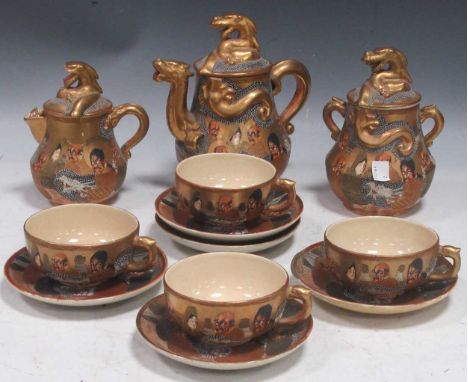 A Satsuma tea set, comprising tea pot, milk jug, sugar basin and three cups and four saucersoverall impression is good but on