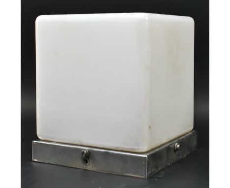 A vintage 20th century Art Deco opaque glass ceiling light. The glass shade of cube form supported by a chrome ceiling mount.