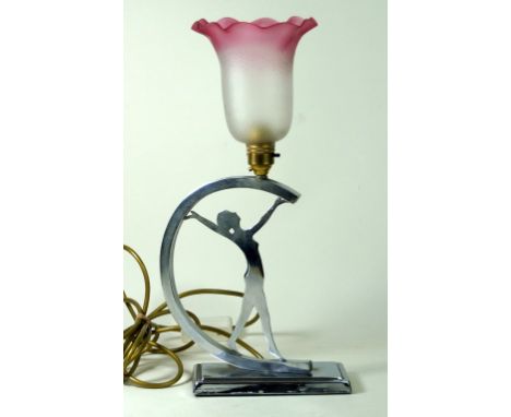 Art Deco chrome table lamp
Modelled in the form of a nude dancing girl with swept arms, fitted with frosted and cranberry gla