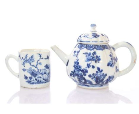 A CHINESE KANGXI BLUE AND WHITE TEAPOT, the ribbed bulbous body painted with foliage and rockwork, unmarked, 10cm high; and A