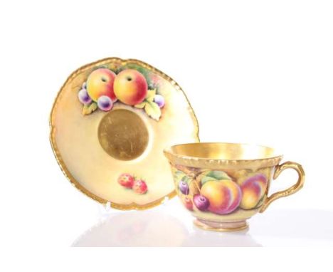 A ROYAL WORCESTER FRUIT PAINTED TEACUP AND SAUCER, painted by Fuller and Jones, black printed marks. Diameter of cup 10cm