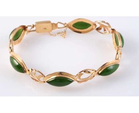 A JADEITE AND GOLD BRACELET, the six tapering oval cabochon cut jadeites all collet set in simple mounts, all alternately spa