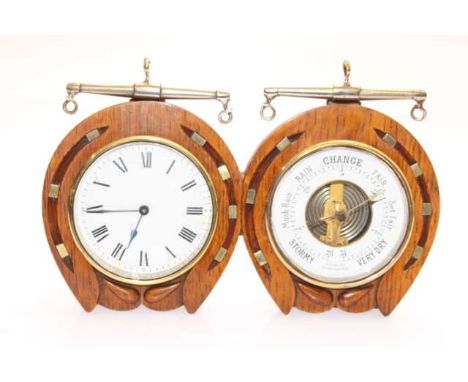 AN OAK AND BRASS DESK CLOCK AND BAROMETER, early 20th Century, in a double horse-shoe shaped frame surmounted by brass hames.