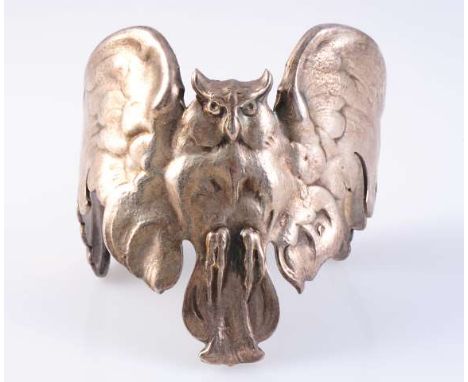 A GERMAN MADE OWL CUFF BANGLE FROM THE JUGENDSTIL MOVEMENT, the moulded metal work forming a realistic owl to the centre with