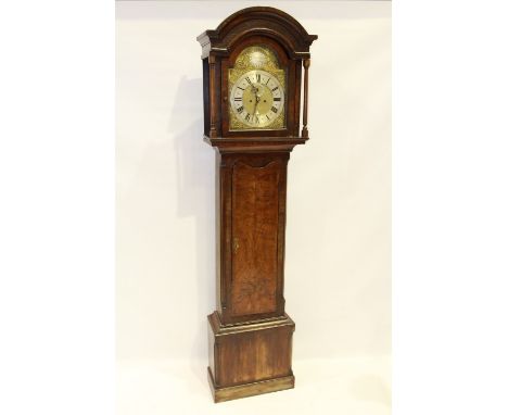 A POLLARDED OAK EIGHT-DAY LONGCASE CLOCK, the 12 inch brass break-arch dial, signed "David Lestourgeon, London", with silvere