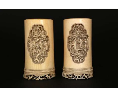 A PAIR OF CHINESE IVORY BRUSH POTS, Canton, 19th Century, each carved front and back with a quatrefoil shaped panel of sages 