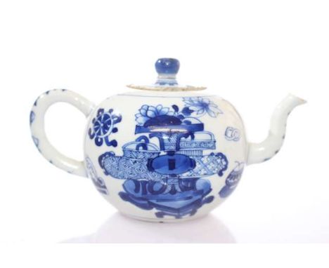 A CHINESE KANGXI BLUE AND WHITE TEAPOT, bullet-shaped, painted with quatre-lobed panels filled with objects, the cover with b