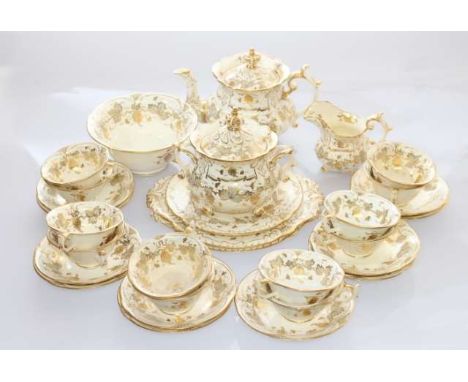 A ROCKINGHAM TEA SERVICE, c.1830-1842, comprising teapot, cream jug, sucrier, slop bowl, pair of serving plates, tea plate, t