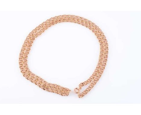 A YELLOW METAL CHAIN, constructed of double 8-shaped links, stamped "500" and "583". 14 grams, 49.5cm