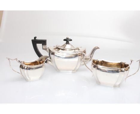 A GEORGE V SILVER THREE-PIECE TEA SERVICE, William Henry Leather, Birmingham 1913, comprising teapot, cream jug and two-handl