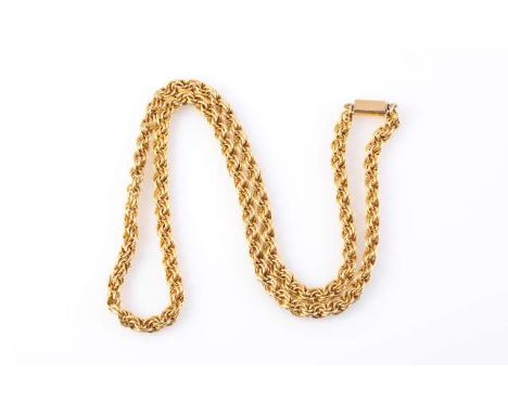 A YELLOW METAL CHAIN, c.1900, formed of multi interlinked circular links to form a twist design, on an integral tongue clasp 