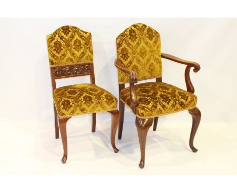 A SET OF NINE LATE 19TH CENTURY OAK DINING CHAIRS, including one carver, each with upholstered arched back panel and stuffed 