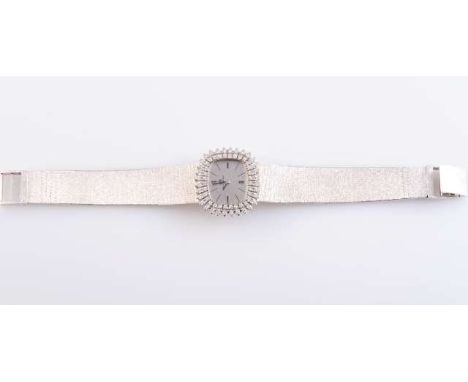 A BUCHERER 18 CARAT WHITE GOLD AND DIAMOND LADY'S WRISTWATCH, the rounded rectangular silvered dial with textured ground and 