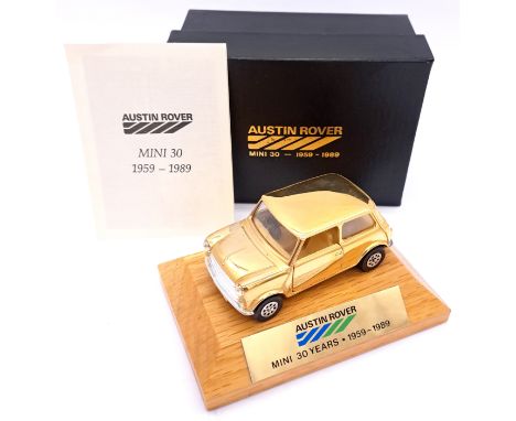 Corgi, a boxed "30 Years of the Mini" presentation model - containing Gold plated Mini, mounted on wooden base, with name pla