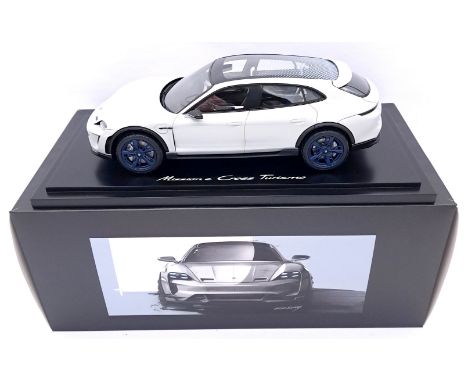 Spark (Minimax), a boxed 1/18 scale Porsche Mission E Cross Turismo in White &amp; Black Model is mounted on elegant plinth a