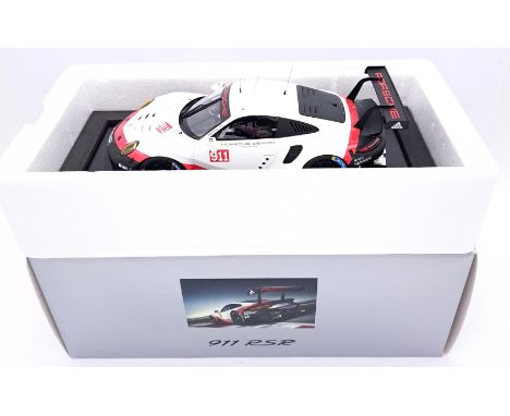 Spark (Minimax), a boxed 1/18 scale Porsche 911 RSR. In White/Red &amp; Black with "Porsche Design Timepieces" decals. Model 