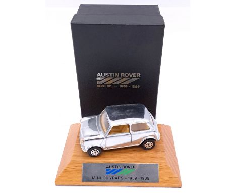 Corgi, a boxed "30 Years of the Mini" presentation model - containing chrome plated Mini, mounted on wooden base, with name p