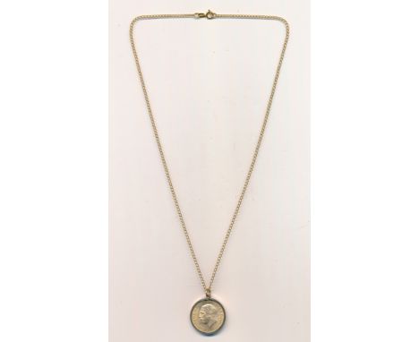 1931SA full gold sovereign in 9ct mount with 9ct chain, total weight approx. 11g.