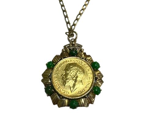 1912 full gold sovereign fine, in mount stamped 18k with chain stamped 9k. Total weight approx. 17g.