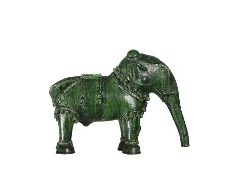An Ottoman green glazed model of a caparisoned elephant, 19th century, possibly Canakkale, Turkey, height 24cm, length 32cm, 