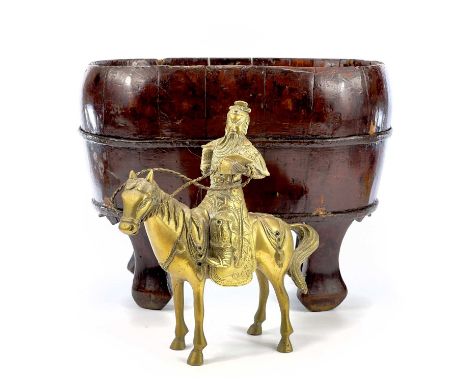 A Chinese metal bound wooden jardiniere, height 27cm, width 35cm, depth 20cm, and a Chinese brass model of a warrior on horse