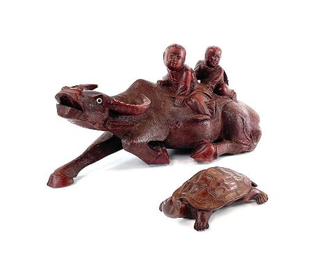 A Chinese carved wood model of a buffalo, circa 1900, height 15cm, length 31cm, width 11cm and a carved wood model of a turtl