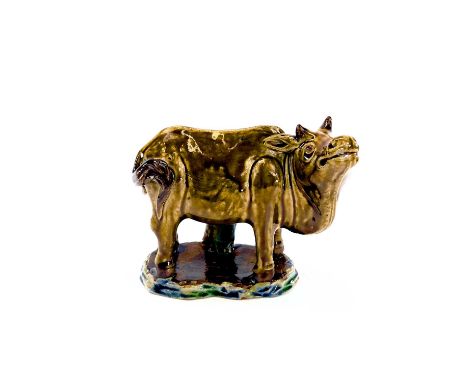 A Chinese sancai glazed pottery model of a water buffalo, circa 1900, in the form of a brushwasher, height 18cm, width 19cm, 