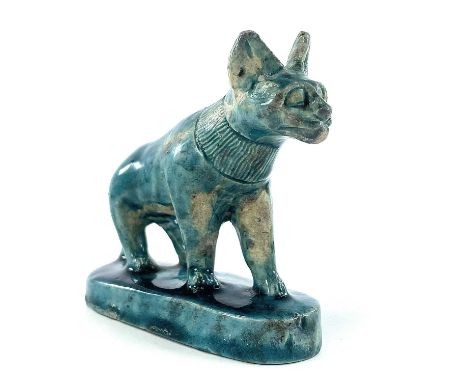 An Egyptian glazed faience pottery model of a cat, possibly ancient , height 8.5cm, length 9cm, depth 4cm.