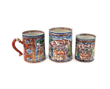 A set of three Chinese graduated porcelain mandarin palette mugs, 18th century, the cylindrical body decorated in underglaze 