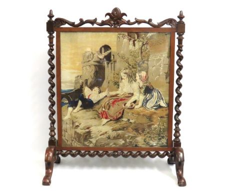 A large, ornate Victorian tapestry firescreen with barley twist decor, 975mm tall x 781mm wide